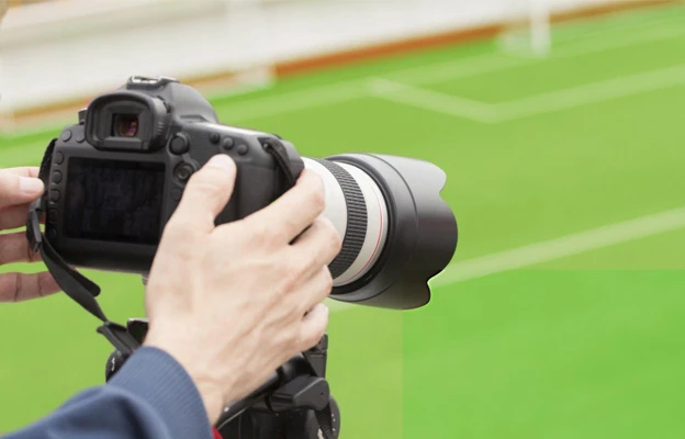 Sports Photography: Freeze the Moment, Capture the Thrill 4 Photographing, filming a sport event.