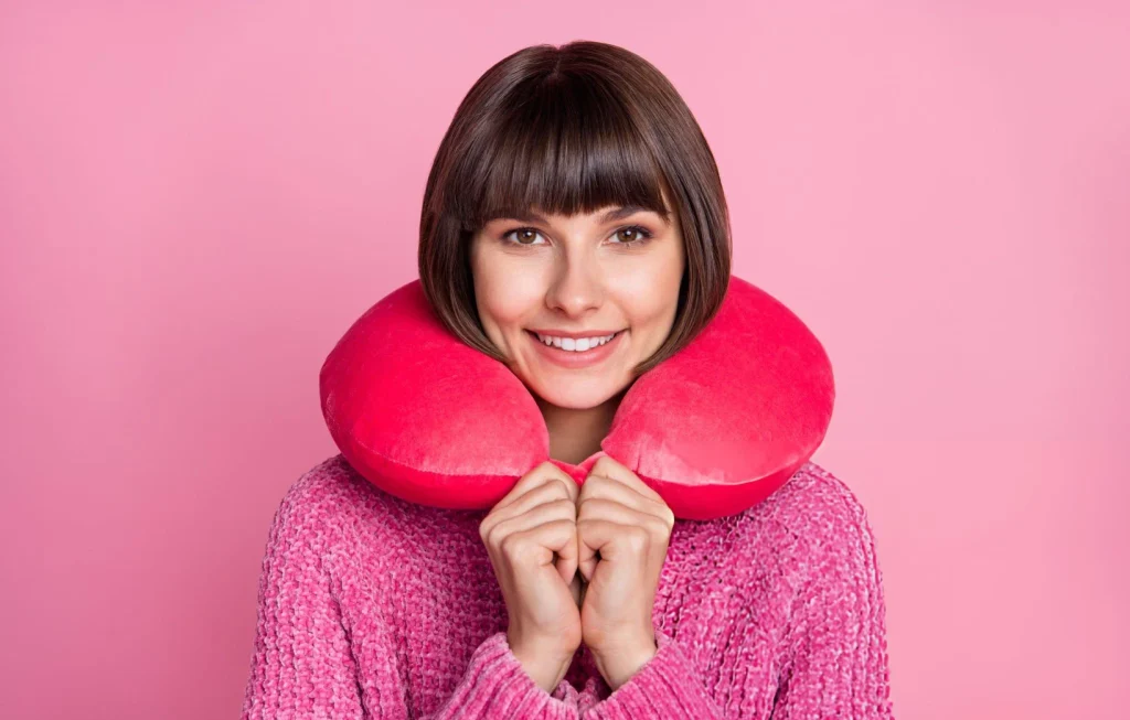 Find the Perfect Travel Neck Pillow for Stress-Free Trips 1 Full length photo of happy charming positive woman